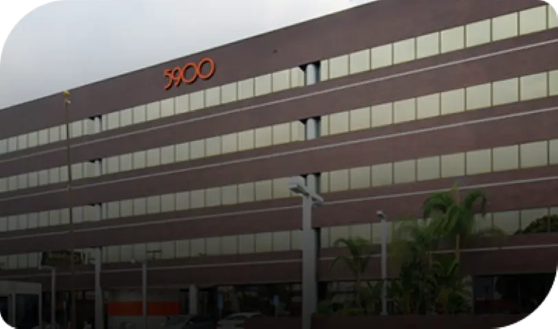 Exterior view of a multi-story office building with suite number 3900.